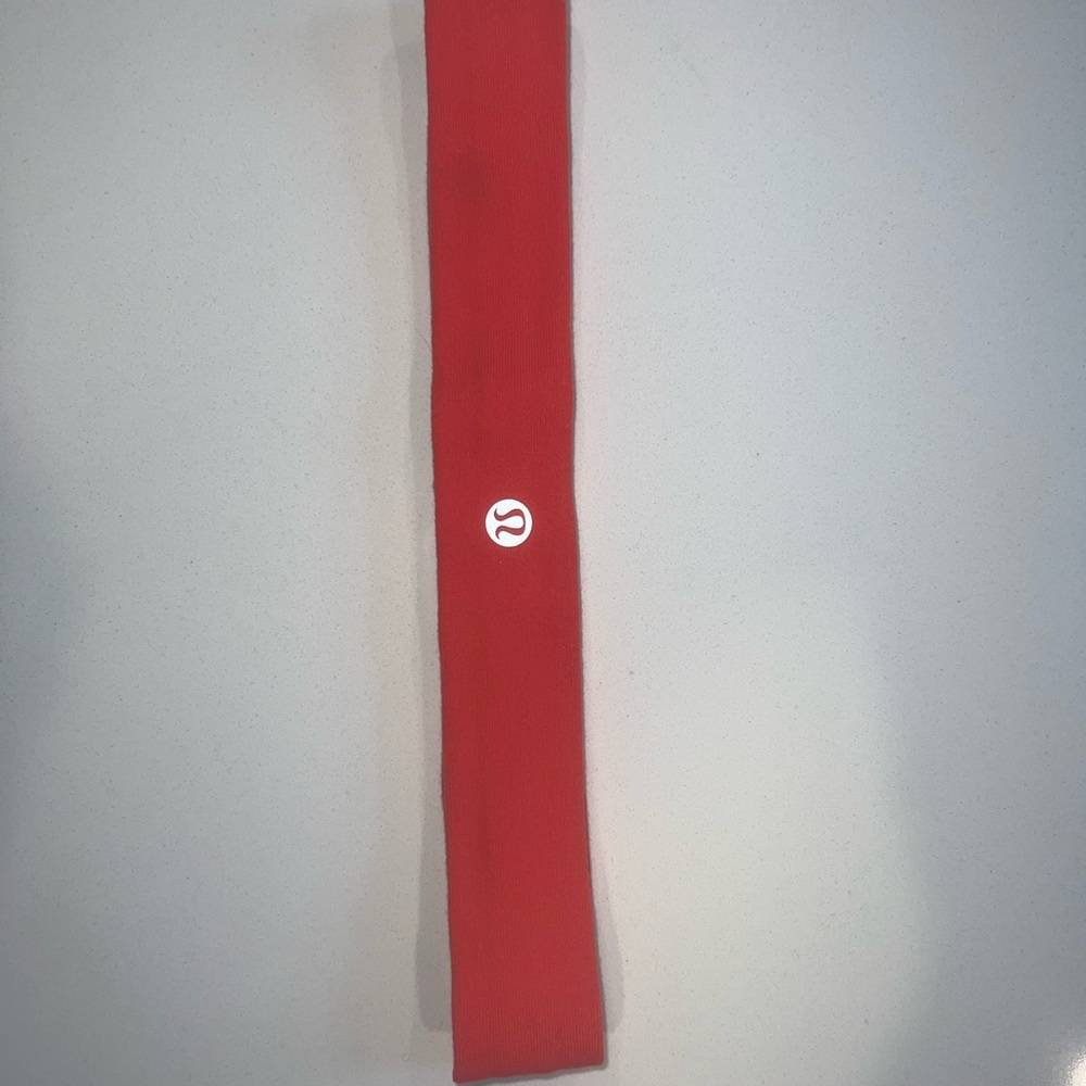 Women’s Lululemon orange red headband in very good condition barely worn